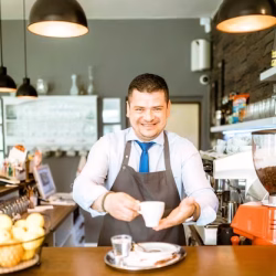 friendly-barman-with-coffee_23-2147821338
